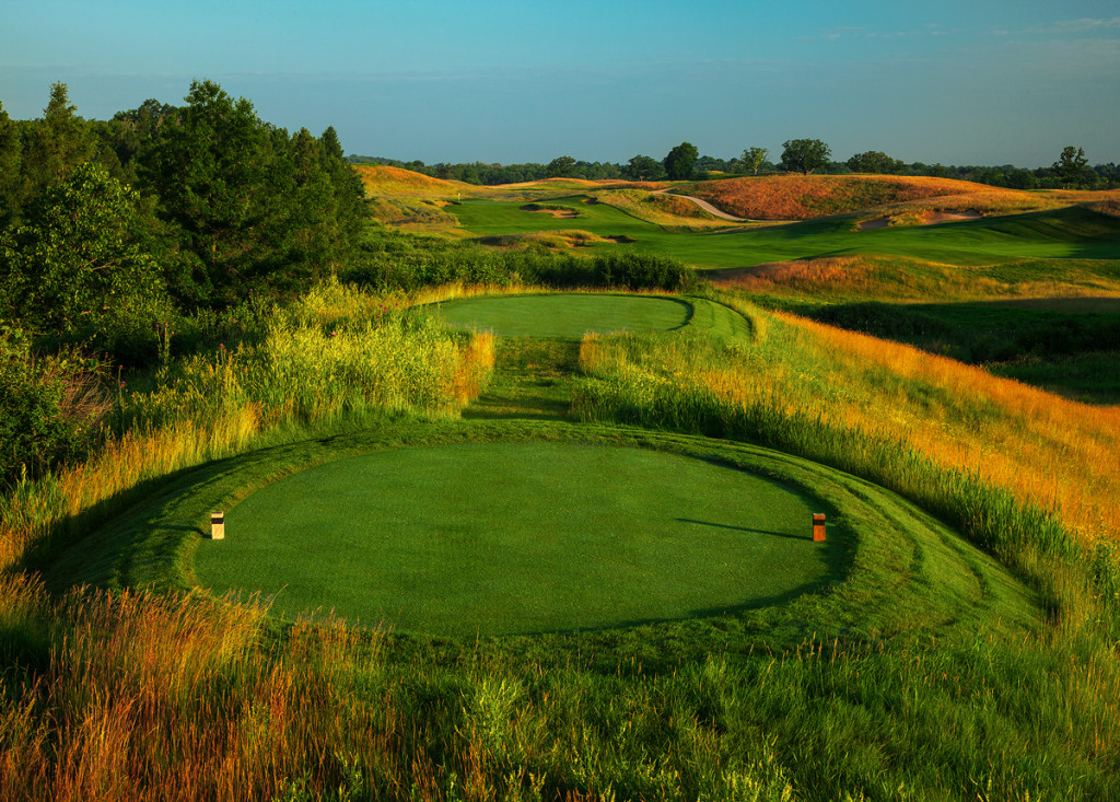 The new green complex (seen from the Black tee box) on the par four 3rd hole at Erin Hills.  The green complex, surround and approach were totally rebuilt between the 2013 and 2014 seasons.  The green was moved to the north of its old location and lowereed a bit to allow run-up approach shots and provide more pin placements as compared to the old severly tiered green.  Erin Hills, a daily fee destination golf course in Erin, Wisconsin, was designed by Hurdzan/Fry and Ron Whitten and built by Landscapes Unlimited, LLC, and has been choosen to host the 2011 US Amateur Chanpionship and the 2017 US Open Championship.  Photo by Paul Hundley.